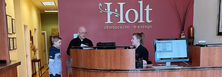 Chiropractor Port Orchard WA Tom Holt With Staff At Front Desk Chiropractor Port Orchard WA Tom Holt With Staff At Front Desk
